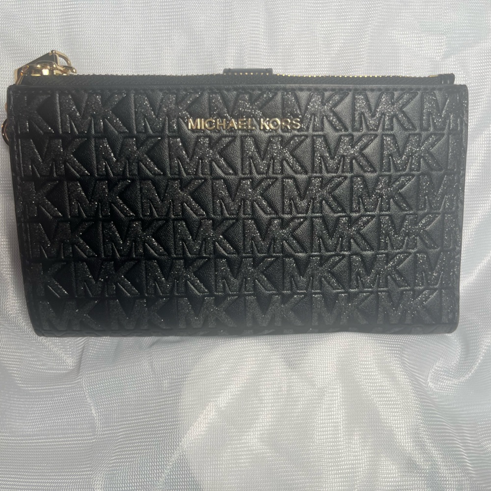 Brand new Michael Kors Black glitter wallet.